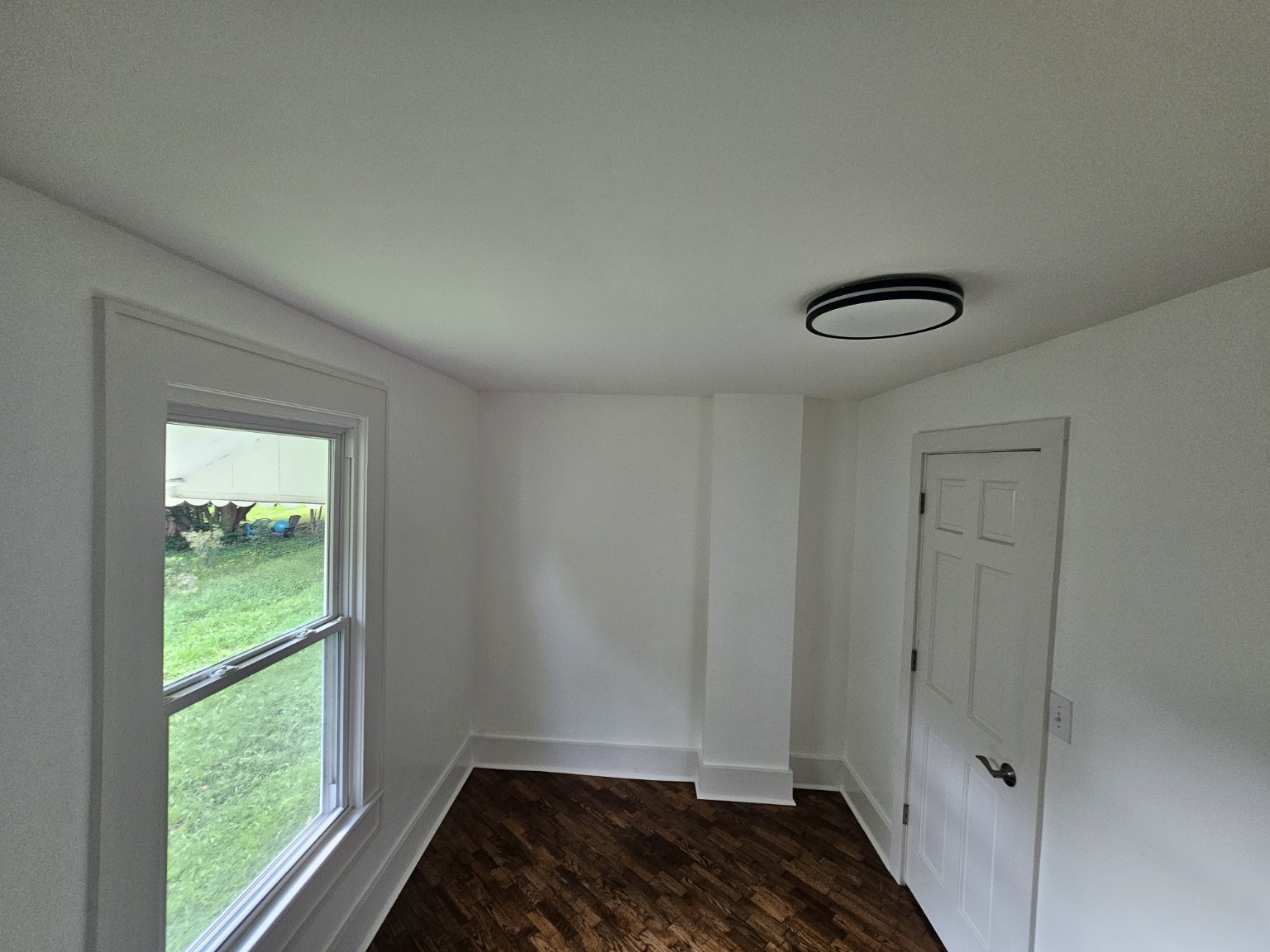 Second bedroom — door and window view at 413 East Anderson
