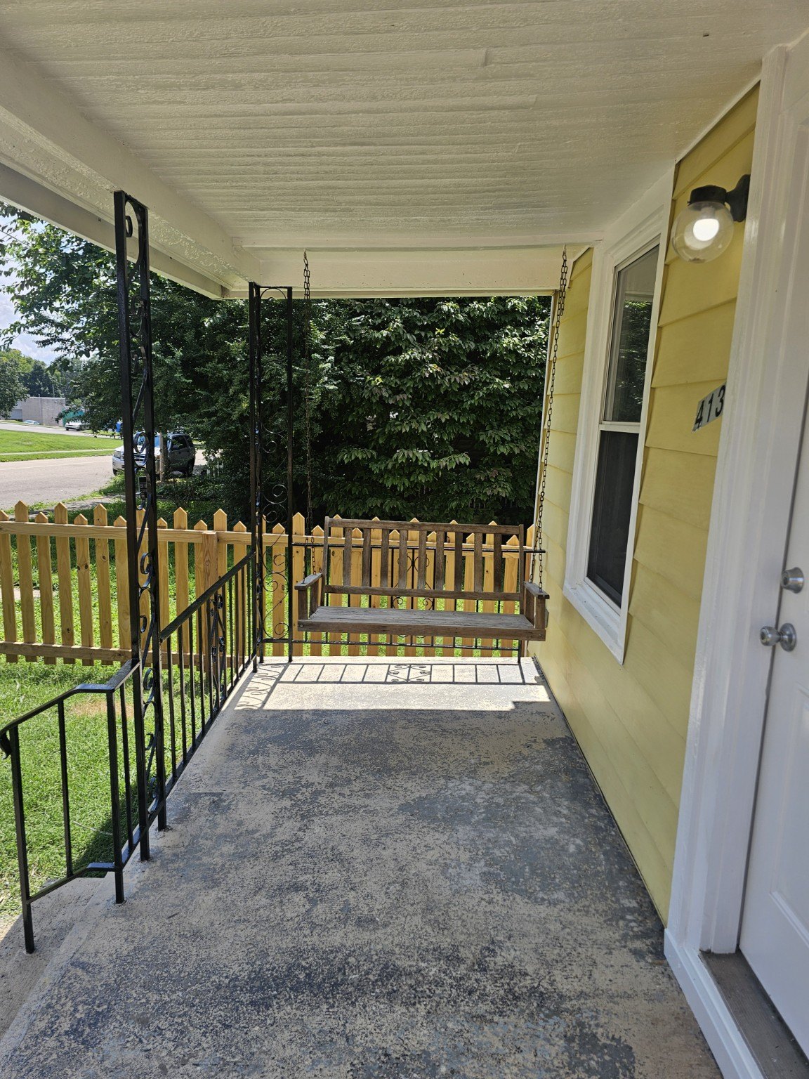 Covered front porch with porch swing
